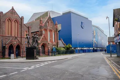 a statue of two men standing in front of a building at Spacious 3-Bedroom Liverpool Home Sleeps 6 Great Transport Links in Liverpool