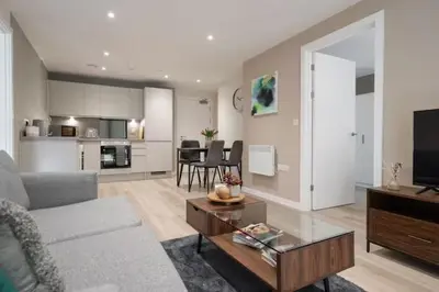 a living room with a couch and a table at Richmond Row Apartments - Free On-Site Parking, WiFi & EV in Liverpool