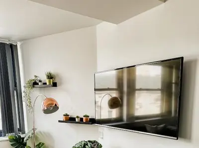a mirror on a wall in a living room at Mathew Street 1 bed apt sleeps 6 in Liverpool