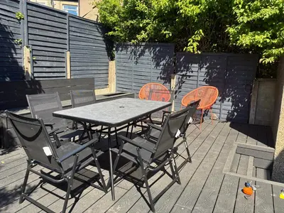 a table and chairs sitting on a patio at Modern and comfortable stay in Morecambe in Morecambe