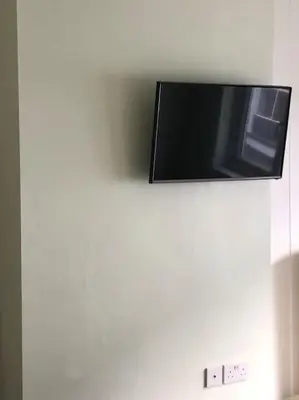 a flat screen tv hanging on a wall at Modern and comfortable stay in Morecambe in Morecambe