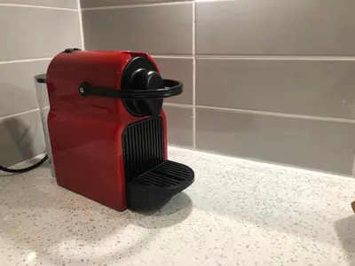 a red suitcase sitting on a counter in a bathroom at Modern and comfortable stay in Morecambe in Morecambe