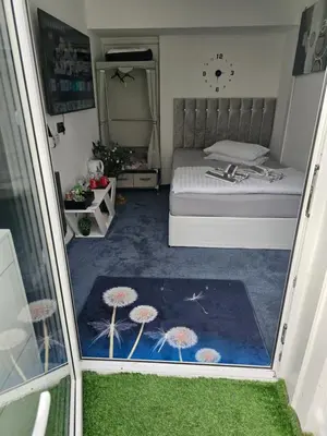 a small bedroom with a bed and a window at Ensuite room with private entrance and private garden in Blackpool