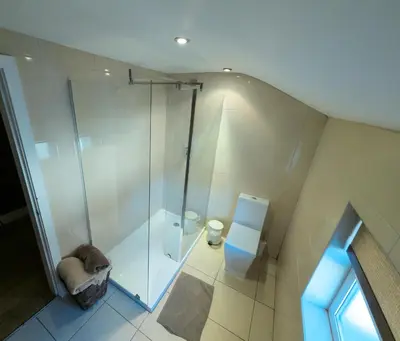 a bathroom with a shower and a toilet at Richmond Apartment in Liverpool