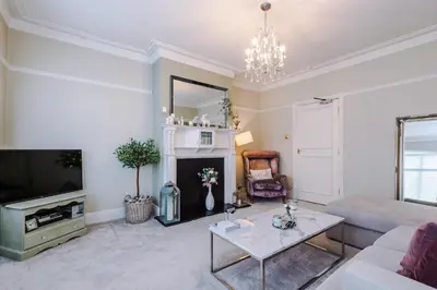 a living room with a couch and a fireplace at Stylish 1-Bed Apartment in St. Annes in Lytham St Annes