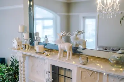 a mirror with two deer statues on top of a counter at Stylish 1-Bed Apartment in St. Annes in Lytham St Annes