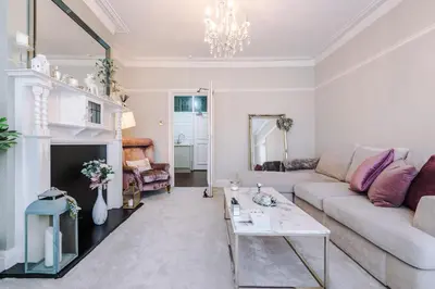 a living room with a couch and a table at Stylish 1-Bed Apartment in St. Annes in Lytham St Annes