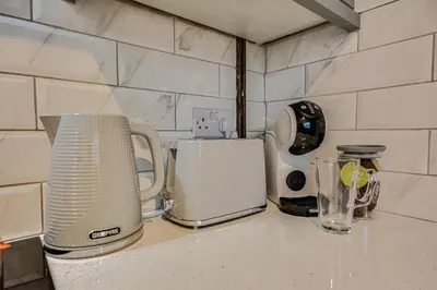 a kitchen counter with a toaster and a blender at Stay With Alexandra 2 Free Parking - high speed Free Wifi close to stadiums in Liverpool