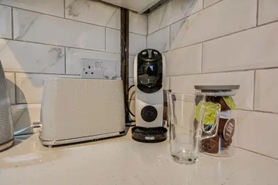 a kitchen counter with a blender and a toaster at Stay With Alexandra 2 Free Parking - high speed Free Wifi close to stadiums in Liverpool