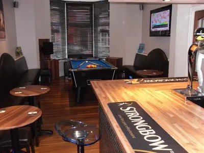 a bar with a ping pong table and a pool table at The Craimar in Blackpool