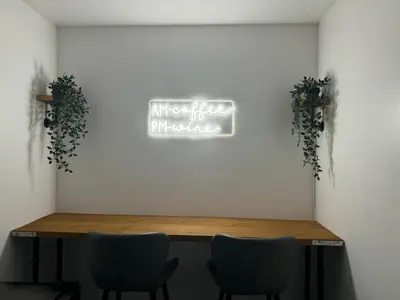 a table in a room with two chairs and a sign at Zetland House Apartment - First floor with garden and parking in Southport