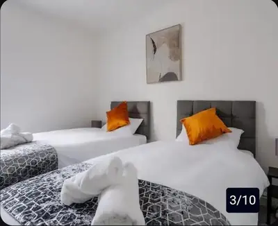 two twin beds in a room with at Providence Luxury Apartment in Liverpool