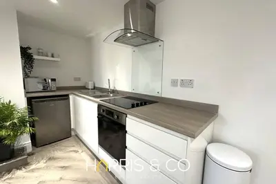 a kitchen with a sink and a stove at Kittiwake in Fleetwood
