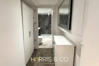 a white bathroom with a sink and a toilet at Kittiwake in Fleetwood