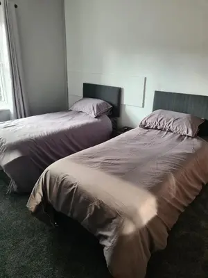 two beds sitting next to each other in a bedroom at The Eagle and Child in Garstang