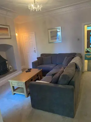 a living room with a couch and a coffee table at Shore Cottage A traditional cosy cottage in Wilpshire