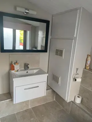 a bathroom with a sink and a mirror at Shore Cottage A traditional cosy cottage in Wilpshire