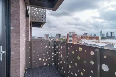 a balcony with a view of a city at Spacious 1 Bedroom Apartment in Central Liverpool in Liverpool