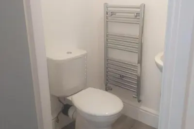 a bathroom with a white toilet and a sink at Liverpool 3-Bed House - Sleeps 6 in Liverpool