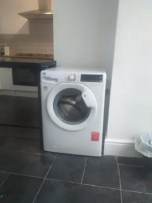 a washing machine sitting in a kitchen next to a counter at Liverpool 3-Bed House - Sleeps 6 in Liverpool