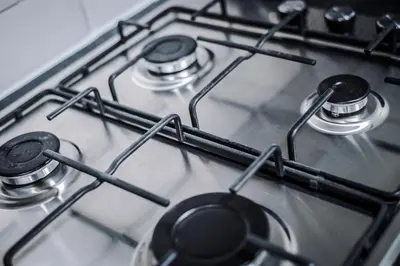a close up of a gas stove top oven at Miranda House - Air Host & Stay - Sleeps 7 in Liverpool