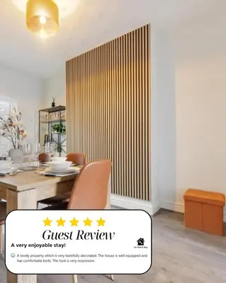 a dining room with a guest review sign next to a table at Miranda House - Air Host & Stay - Sleeps 7 in Liverpool
