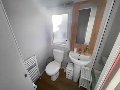 a small bathroom with a toilet and a sink at Edith Rose in Middleton