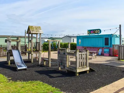 a playground with a slide at Marni's Seaview in Heysham