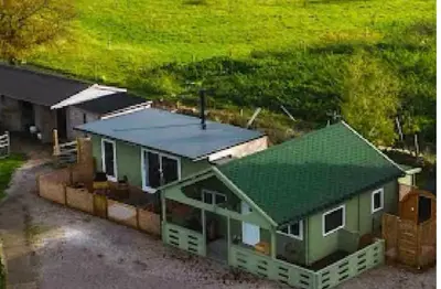 an overhead view of a house with a green roof at Fearless Fox Lodge in Altham
