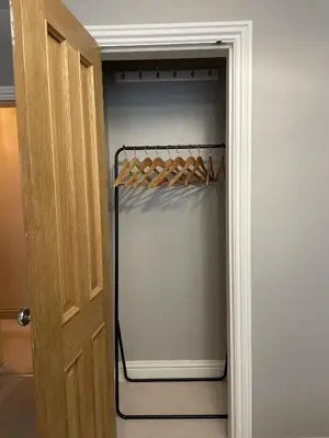 a closet with wine bottles on a rack at Priory Gardens – Birkdale - 2 bed in Southport