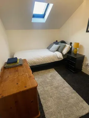 a bedroom with a bed and a skylight at Bay Wind Deluxe in Morecambe