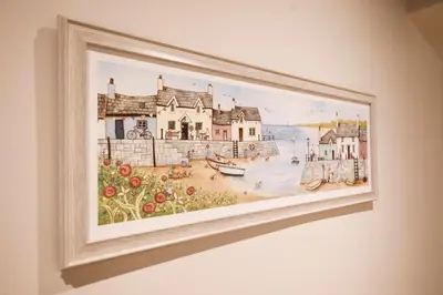 a picture of a painting hanging on a wall at Oceania Suites in Blackpool