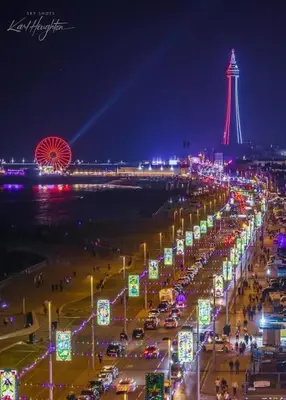 a beach at night with a tower in the background at GGs Holiday Let in Poulton le Fylde