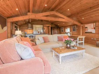 a living room with a couch and a coffee table at Artisan Lodge in Preston
