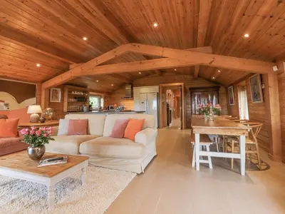 a living room with a couch and a table at Artisan Lodge in Preston
