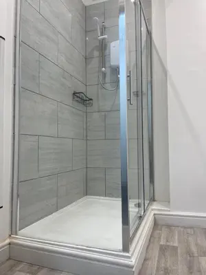 a shower with a glass door in a bathroom at Ground Floor - Balmoral Stays - Apartment 2 - Sleeps 6 Free WiFi in Blackpool