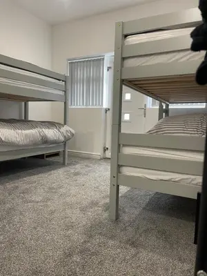 a bedroom with two bunk beds in a room at Ground Floor - Balmoral Stays - Apartment 2 - Sleeps 6 Free WiFi in Blackpool