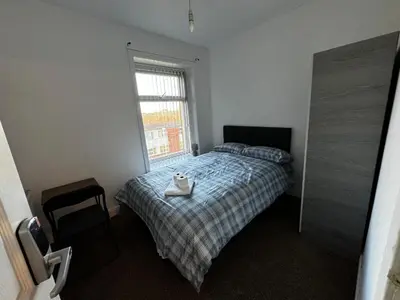 a bedroom with a bed with a tray on it at Double bed BW3 Accrington Burnley in Accrington
