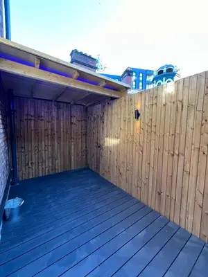 a wooden privacy fence with a wooden deck at 101 Bold Street Apartments in Liverpool