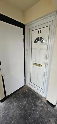 a white garage door with the number on it at Swindon Dream in Liverpool