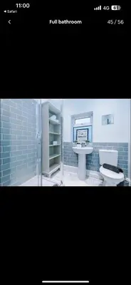 a bathroom with a toilet and a sink at Walton Residence in Liverpool