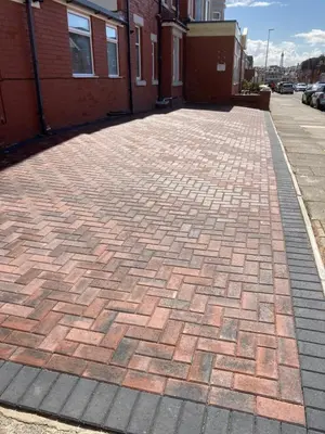 a brick sidewalk in front of a building at The Fernroyd in Blackpool