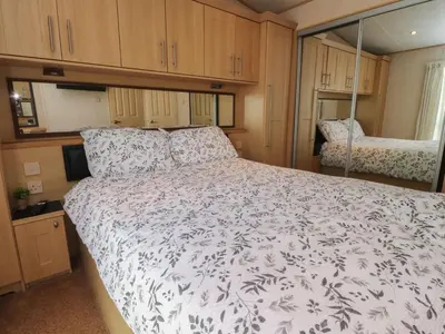 a bedroom with a large bed in an rv at Ashcroft in Preston