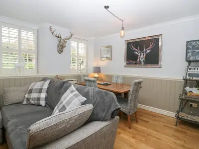 a living room with a couch and a table at 1 Boarbank Farm in Grange Over Sands