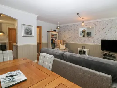 a living room with a couch and a table at 1 Boarbank Farm in Grange Over Sands