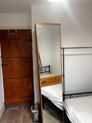 a mirror sitting on top of a bunk bed at Perfect House for Healthcare worker in Barrow in Furness