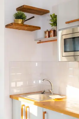 a kitchen with a sink and a microwave at No 27 Liverpool in Liverpool