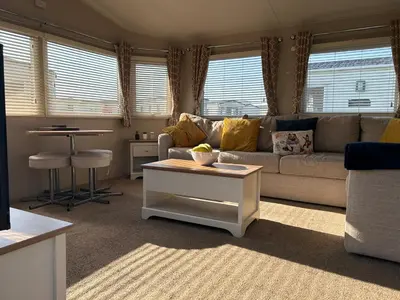 a living room with a couch and a table at J&D by the sea in Heysham