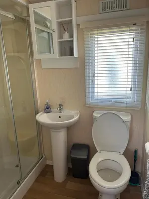 a bathroom with a toilet and a sink and a shower at J&D by the sea in Heysham