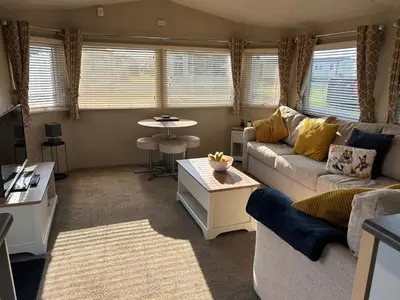 a living room with a couch and a table at J&D by the sea in Heysham
